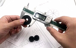 Checking a rubber grommet with a digital caliper